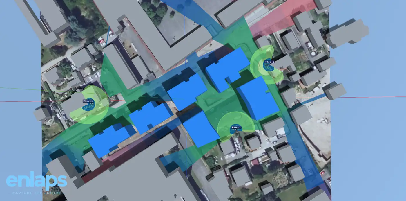 Simulateur 3D Enlaps : couverture de trois caméras timelapse sur un site, bâtiments à construire en bleu